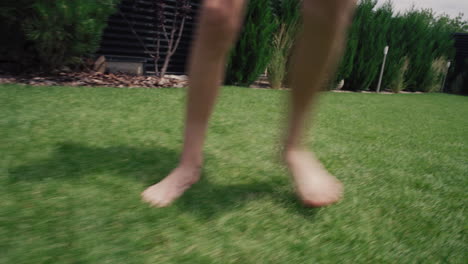 child playing soccer in a garden