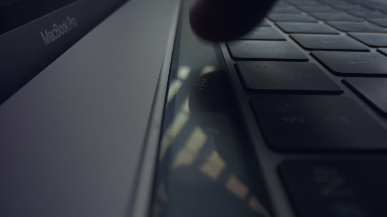 Man using touch bar on laptop