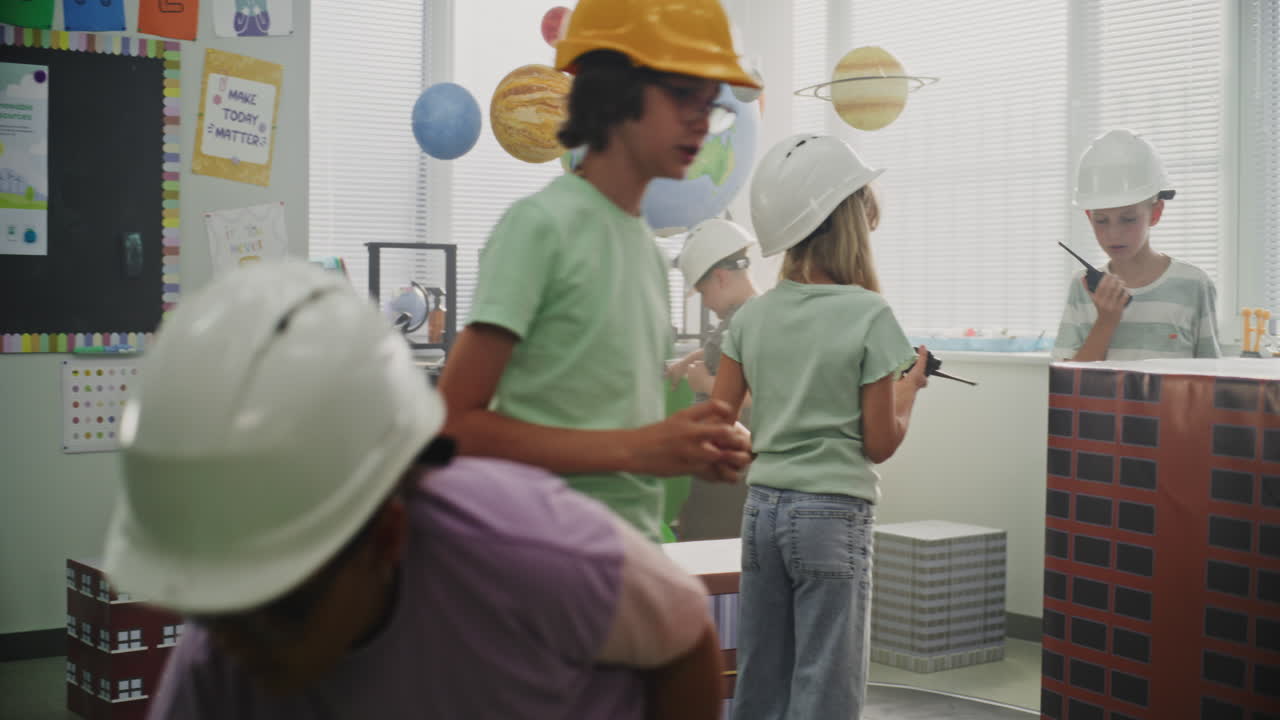 Smart Young Kids in Hardhats Creating Interactive Urban Planning