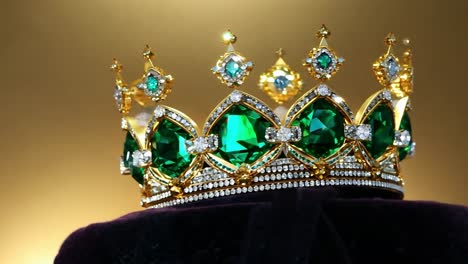 golden crown featuring emeralds and diamonds represents royalty, power, and luxury in a stunning display of elegance