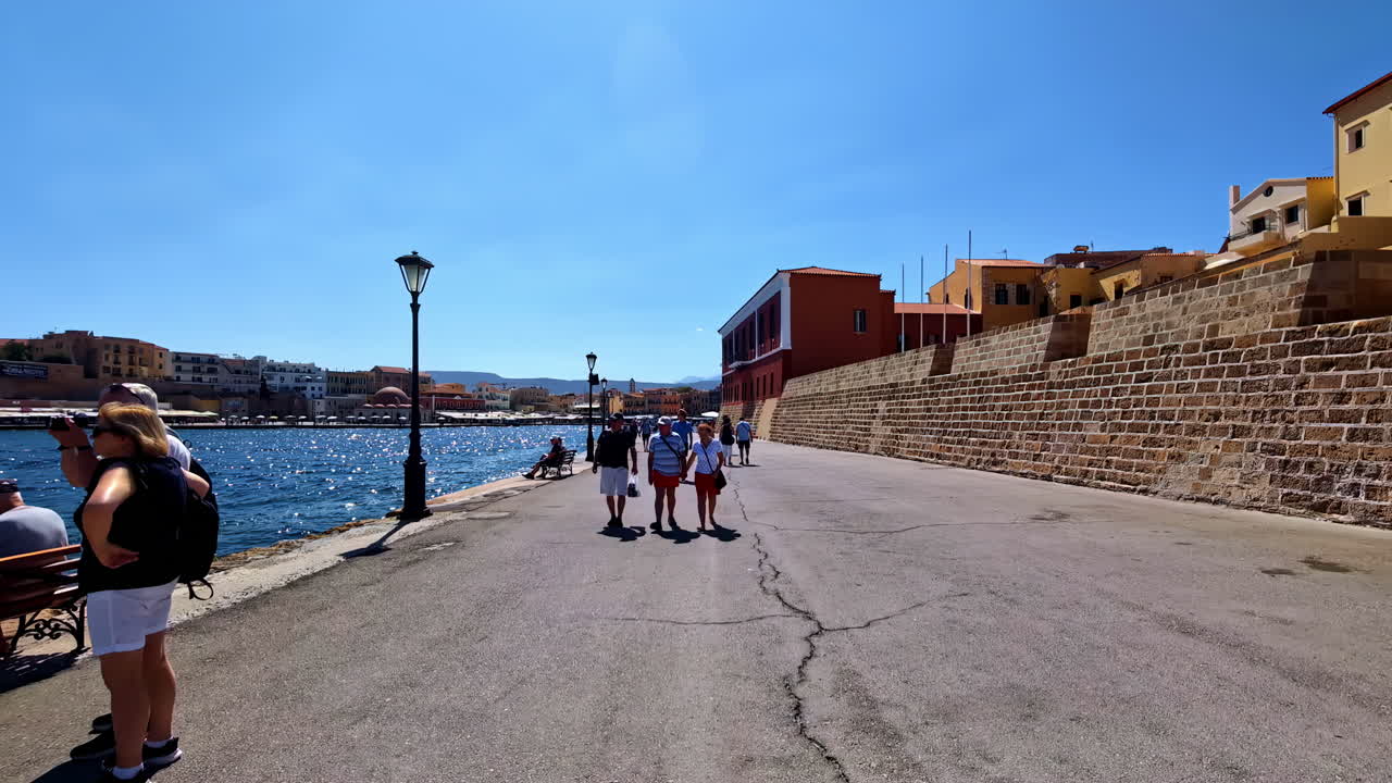 Walking along the Venetian harbor in Chania, Crete