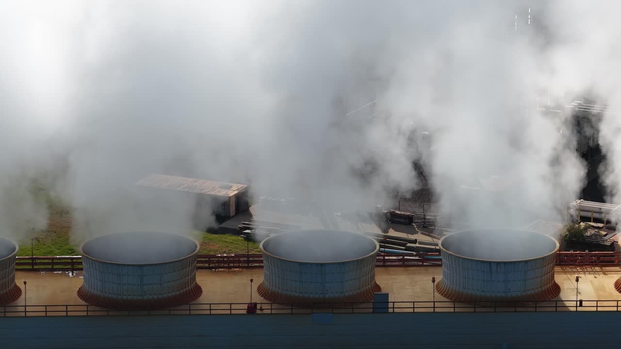 Aerial view of steam pouring from stacks of a CoGen Power Plant