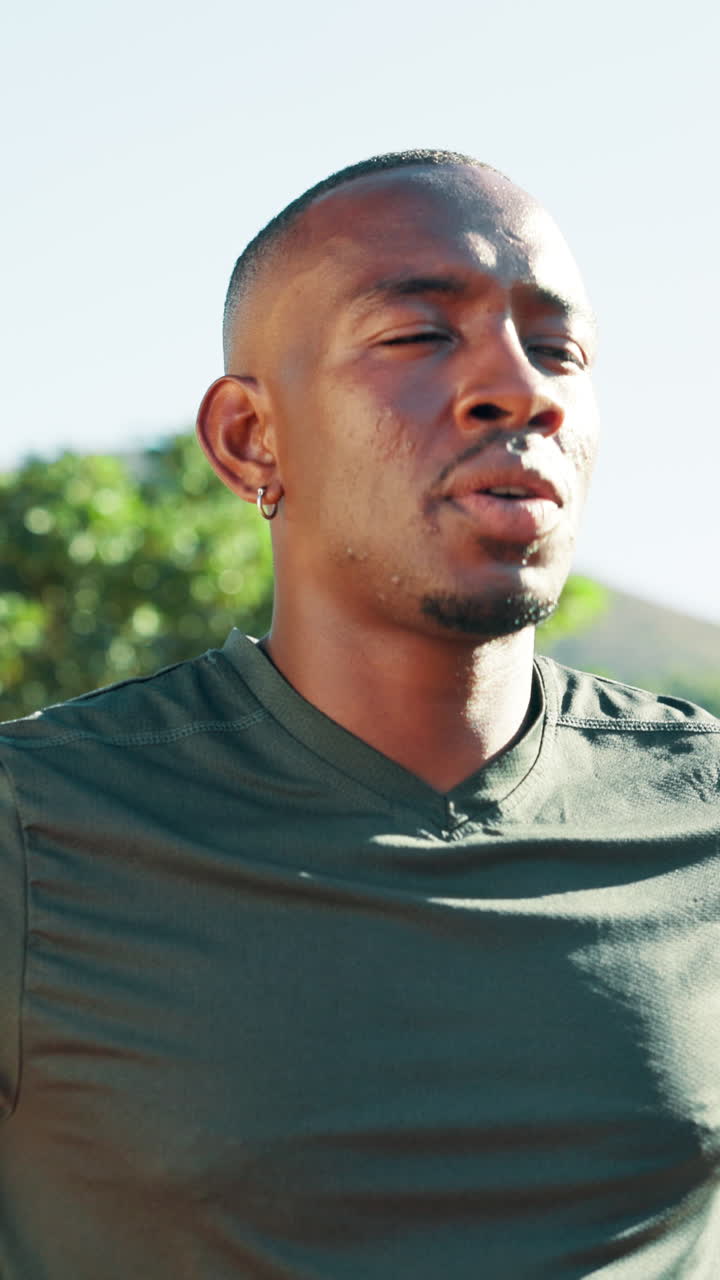 Young Black Man Wiping Sweat During Outdoor Workout