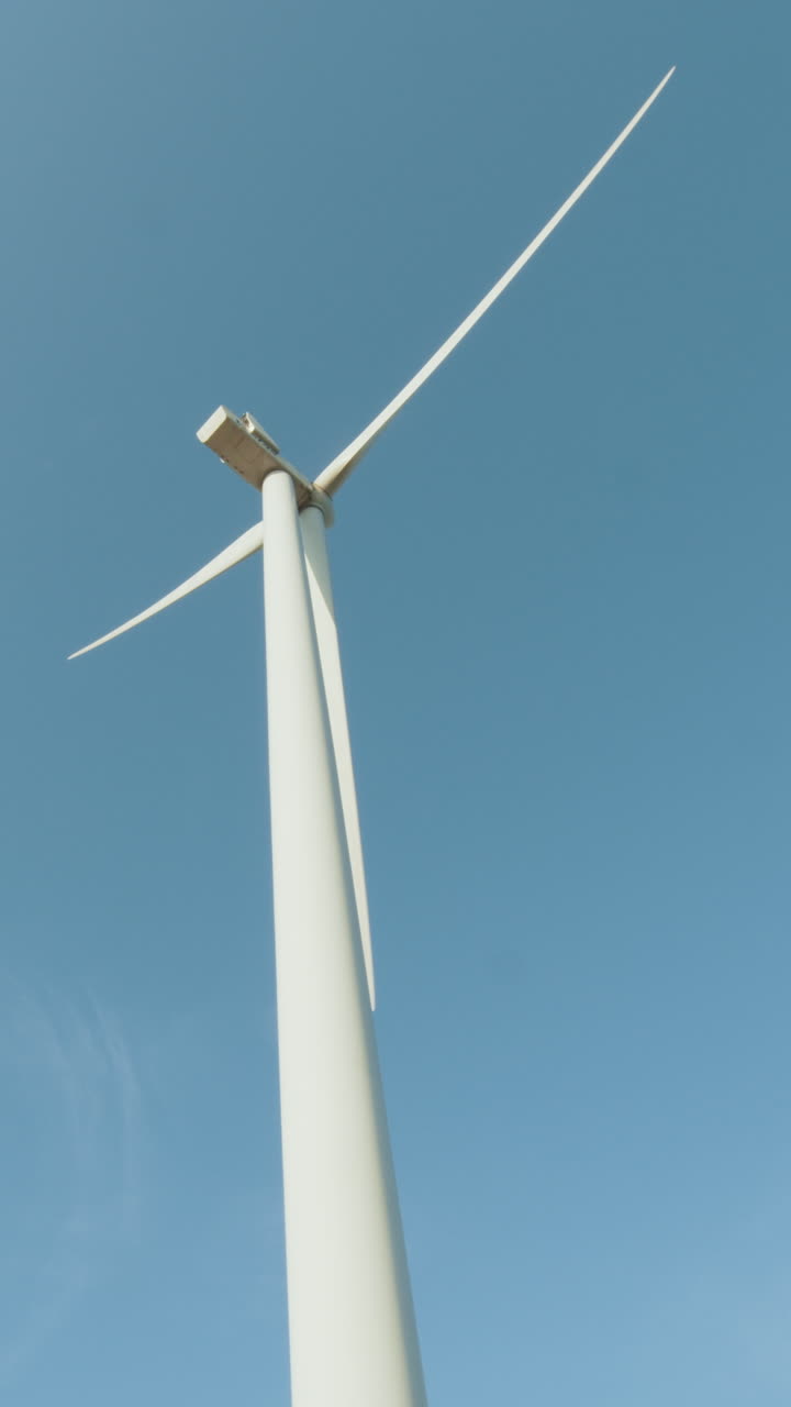 Wind turbine against blue sky