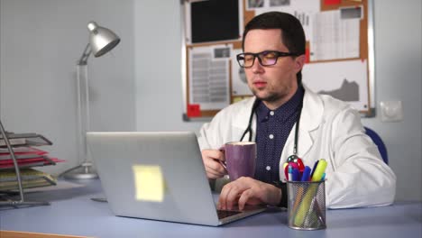 doctor working on laptop