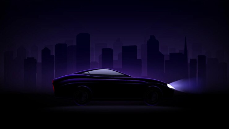 Black Car Driving Through a City at Night