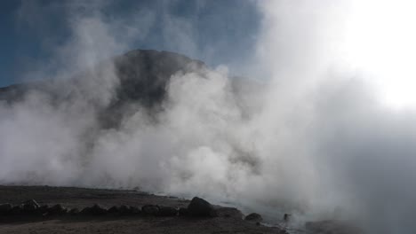 Big-Geyser-Field-Releasing-Steam-at-Sunrise-in-the-Desert-Mountain-Background