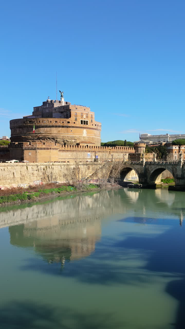 Rome, Italy - February 16, 2024: St. Angelo Bridge across River Tiber near the Sant'Angelo Castle. Vertical
