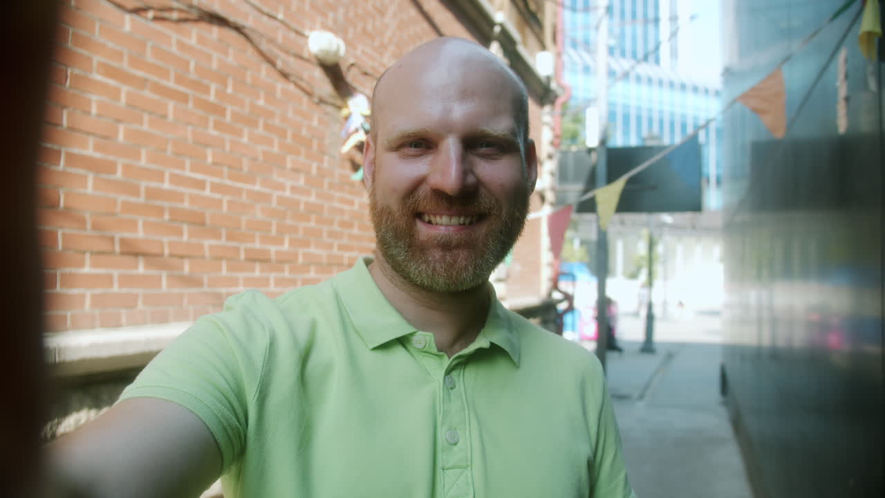 Man taking a selfie in a city alley