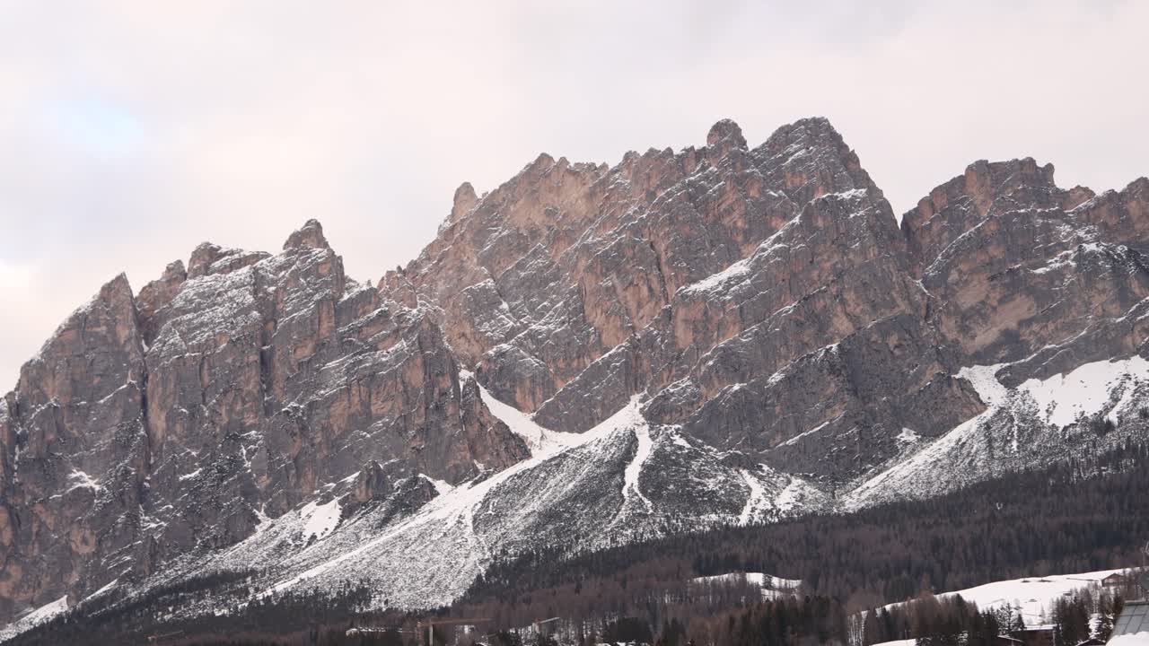 Breathtaking close-up of the snow-covered jagged peaks of the Dolomites in Cortina d'Ampezzo. Dramatic winter landscape in the Italian Alps