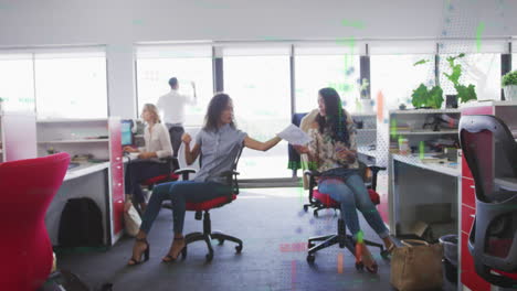 financial data processing against two african american women discussing over a document at office