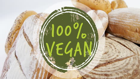animación de texto vegano al 100 por ciento sobre pan fresco