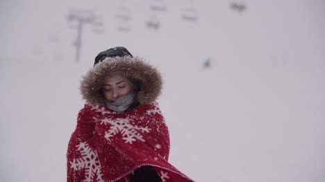 close up of frozen woman wrapped in a blanket at snowstorm 1