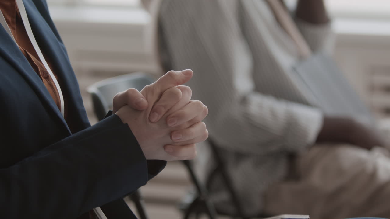 Unrecognizable Businessperson Clenching Fingers