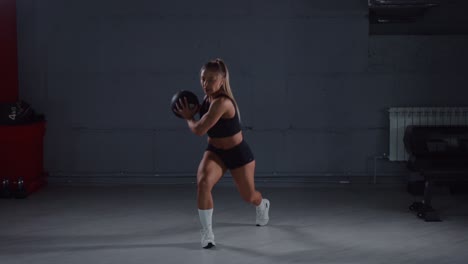 woman exercising with a medicine ball