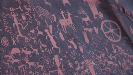 medium shot of american indian petroglyphs at newspaper rock utah