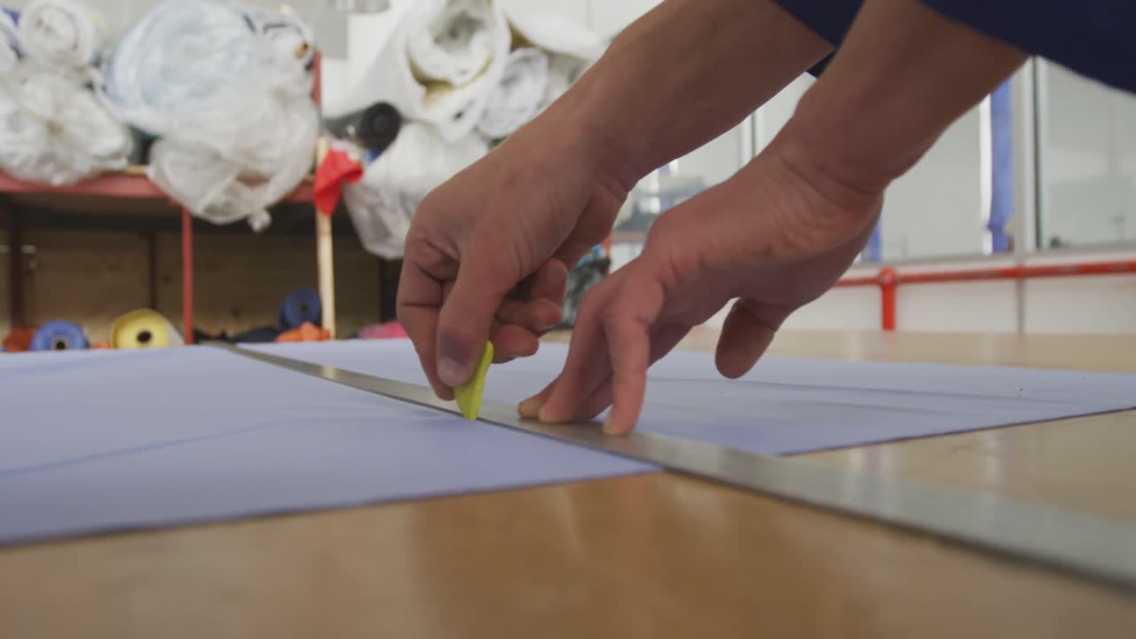 Worker measuring at the rule