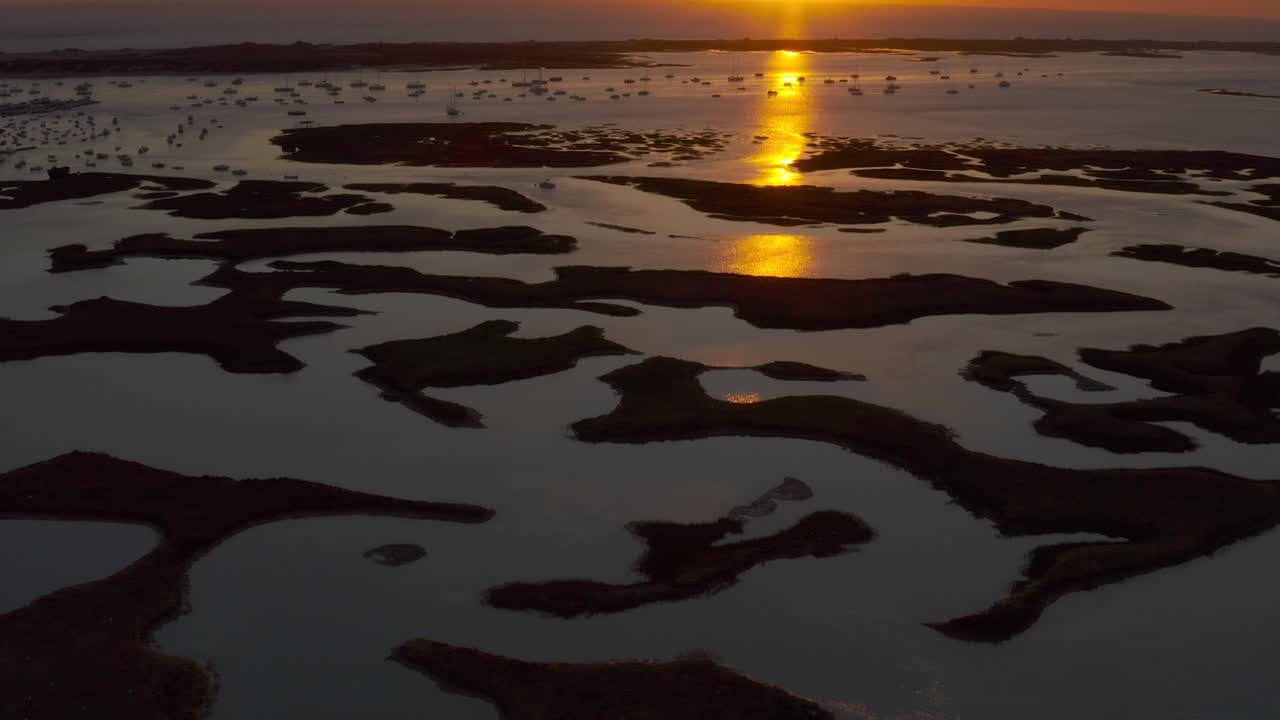 Sunset over a Coastal Bay with Boats