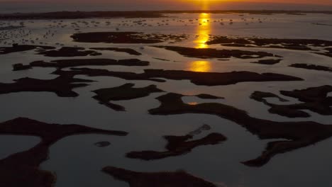 sunset over a coastal bay with boats