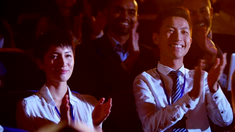 multi-ethnic business people applauding in business seminar at auditorium 4k