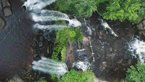 waterfall in lush green jungle of cambodia