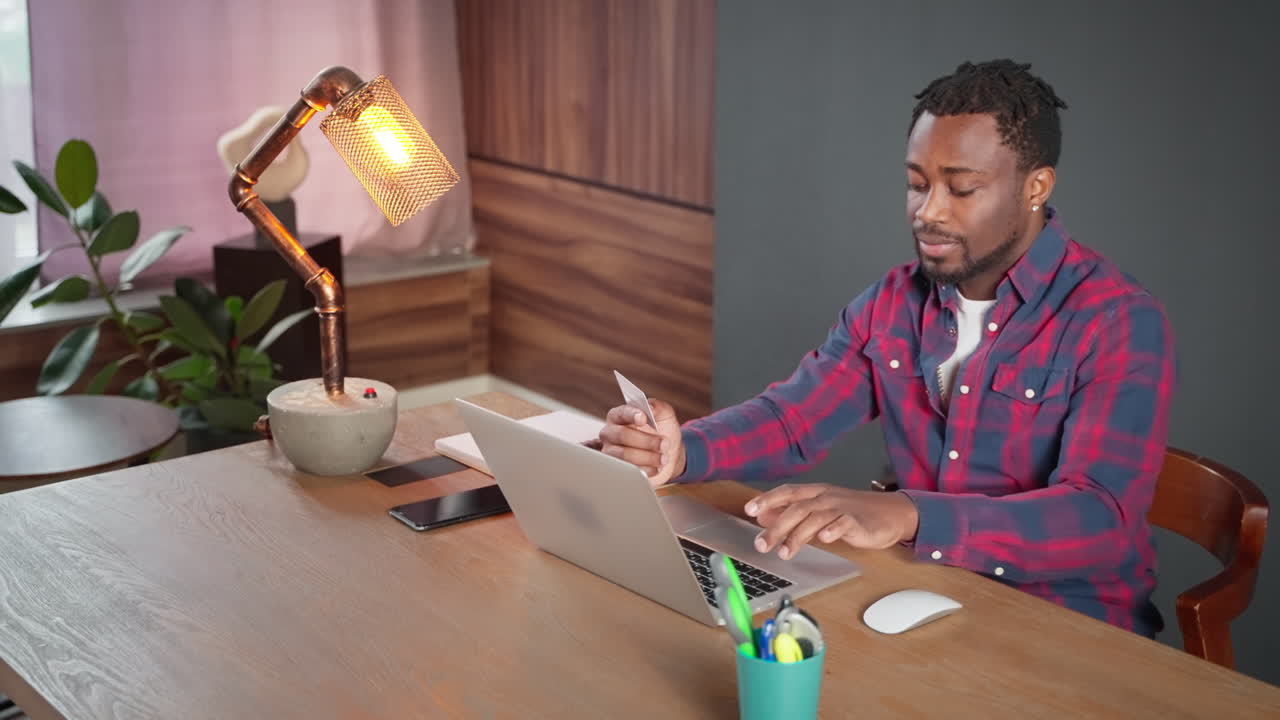 Man using laptop and credit card