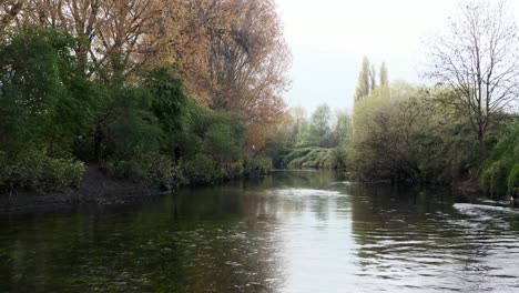 low drone shot over beautiful calm river