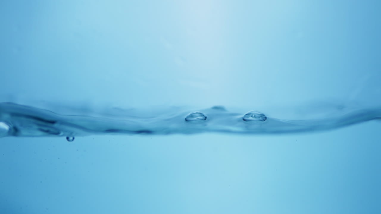Clear Water Surface with Waves and Bubbles