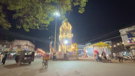 night scene at a clock tower in an indian city