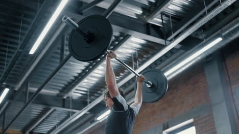 Kickboxer lifting dumbbells