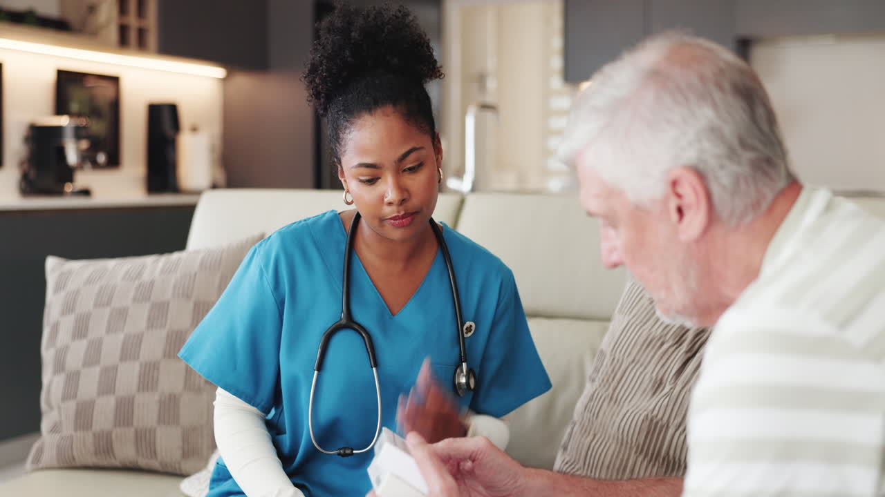 Nurse Explaining Medication to Senior Man During Home Visit