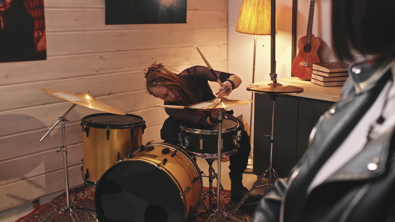 Girl Band Playing Grunge Music In Studio