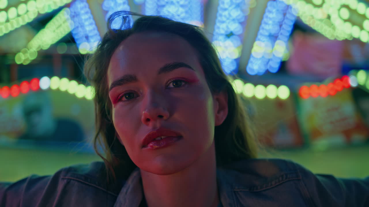 Closeup fashion model posing at night lights. Attractive girl enjoying evening