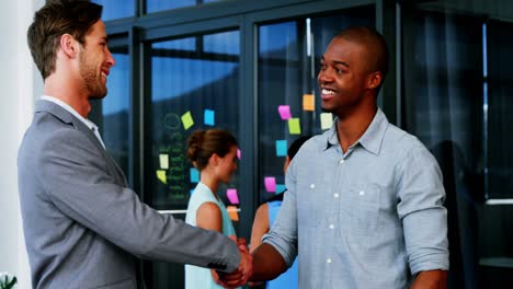 Business-executives-shaking-hands-with-each-other