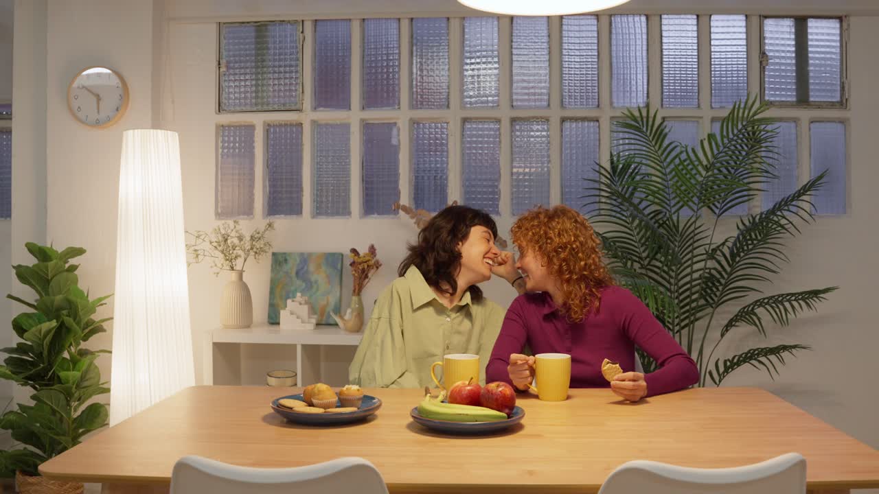 Two women having a snack at the table