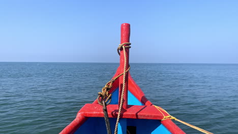 Bow-of-long-tailed-boat-in-motion-of-moving-forward-Goa-India-4K