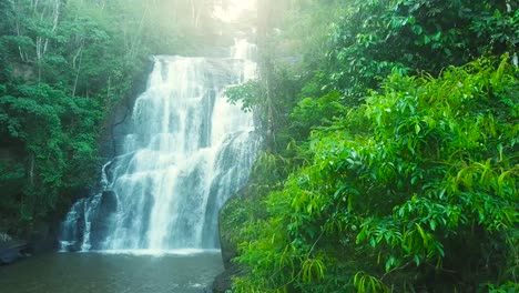 phenomenal establishing 4k shot of beautiful waterfall in woods with big rocks, brazil minas gerais
