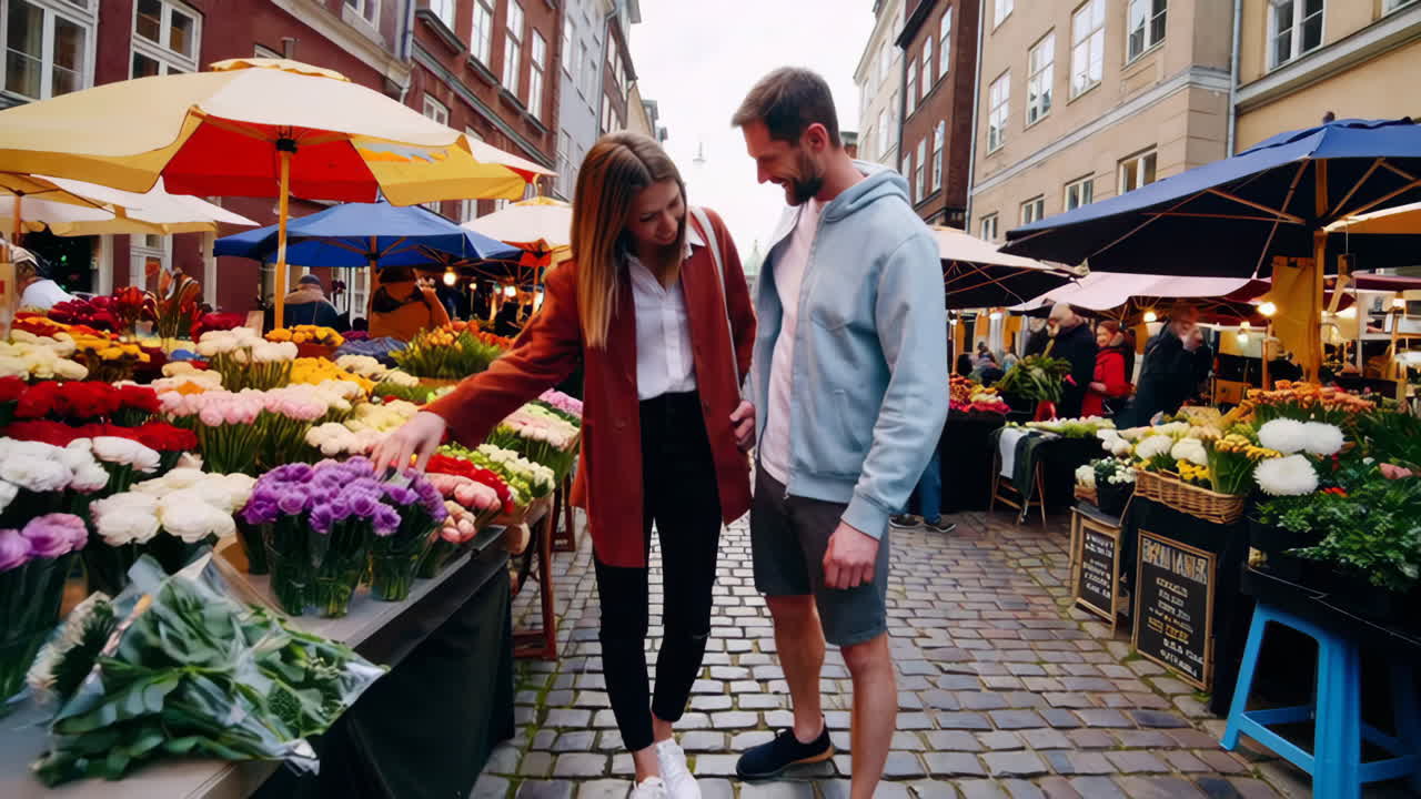 Couple exploring a vibrant flower market in a European city