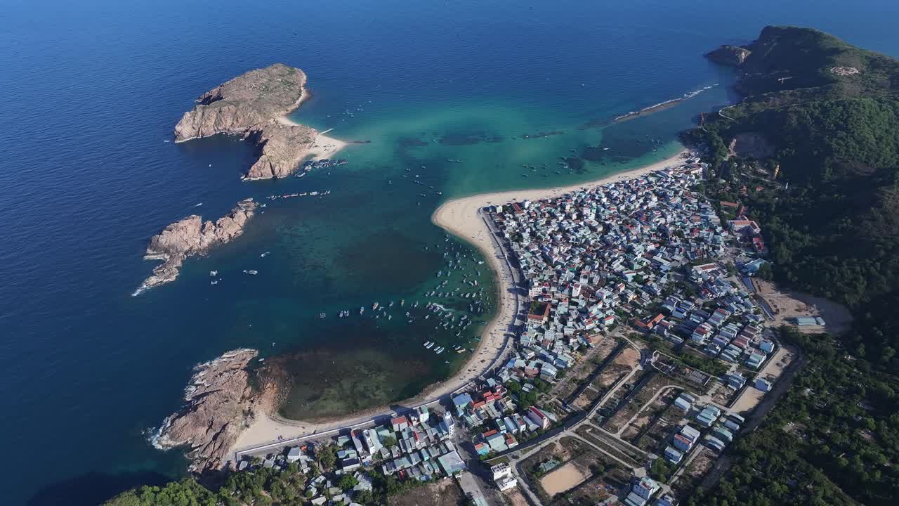 Aerial View of a Coastal Fishing Village with Boats in a Bay