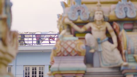 south indian old temple architecture design, clothesline with clothes in background