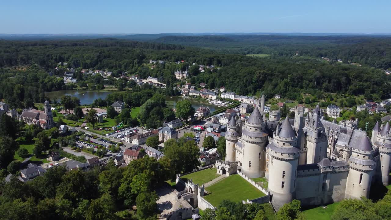Aerial view by drone, Pierrefonds castle at France. Village, lake and forest