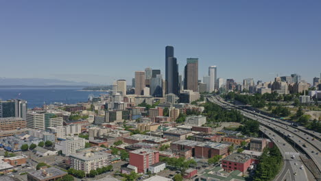 seattle washington aerial v116 panning shot of highway, elliot bay, and high rise downtown - june 2020