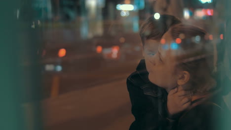 Boy-Hugging-Mother-while-Waiting-for-the-Bus