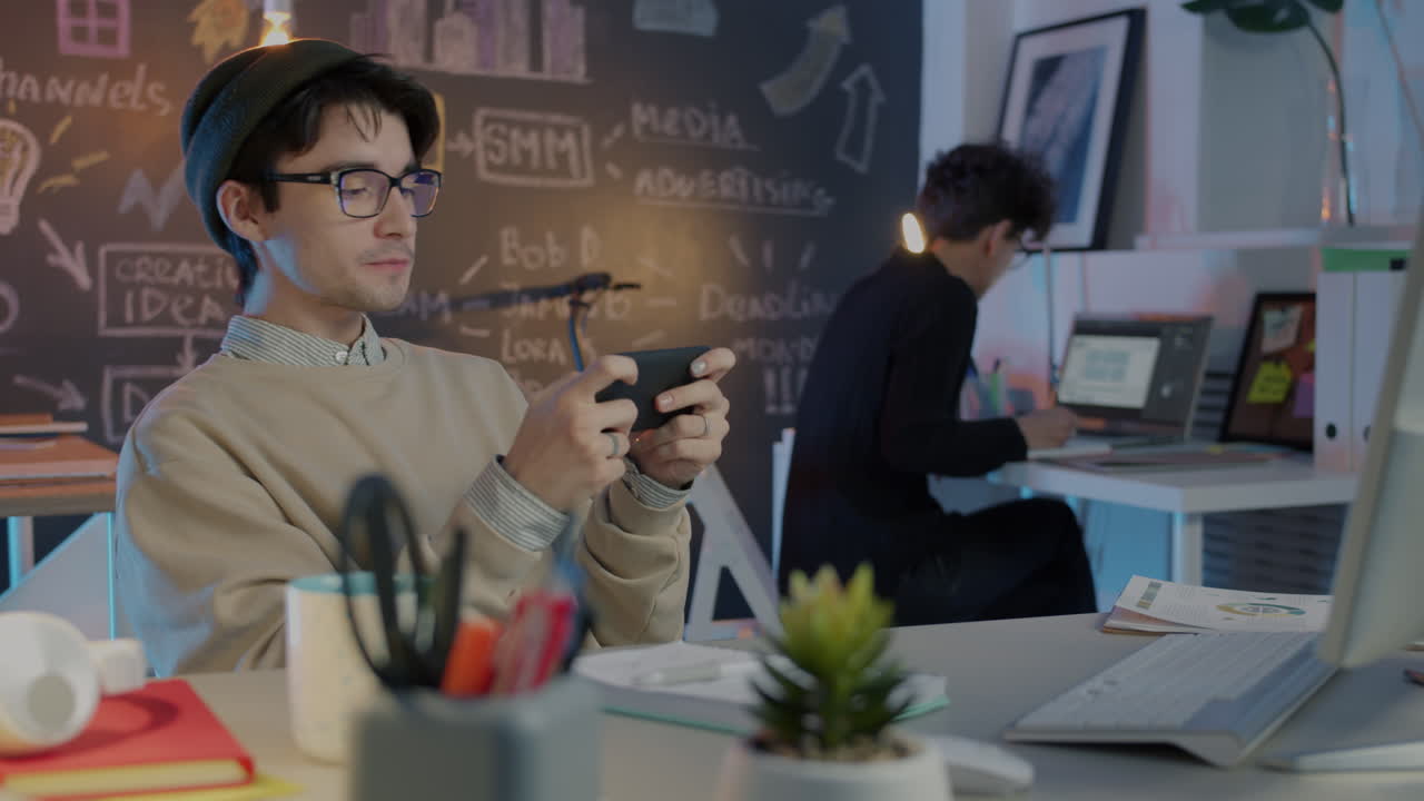 Young people working in a modern design office