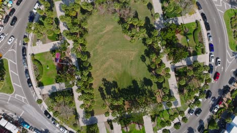 Overhead-view-of-city-center-in-Florida-with-American-flag-waving