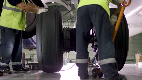 airplane wheel maintenance in hangar