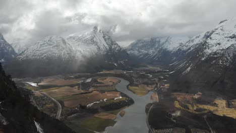 norwegian nature in early spring - snowy peaks, beautiful valleys and heavy clouds