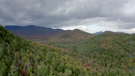 dark storm clouds hanging over a mountain ridge, drone shot