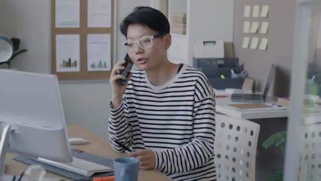 woman on phone call in modern office