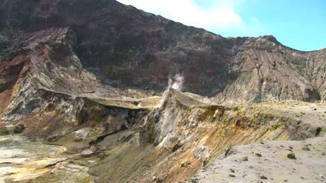 whakaari white island volcanic crater with sulfur color, active geothermal land